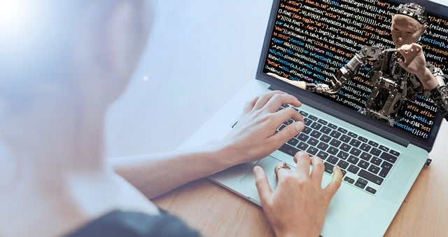 a person typing on a laptop